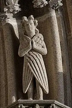 One of the angels in the west porch voussures