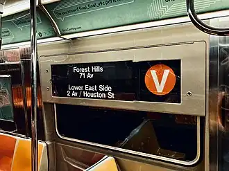 An R68A displays the V train's old bullet and destinations. Most rollsigns retain a V bullet.