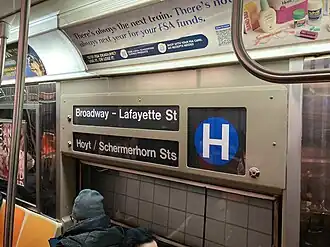 An R68 operating erroneously displays the blue H train bullet for the Rockaway shuttle.