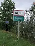 City limit signage in Hungarian and German
