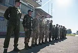 Military personnel from participating countries in the "Rapid Trident-2014" exercise assembling in front of the command post of the training center, on September 19, 2014.