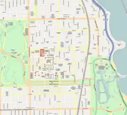 a street map with a portion of a block designated with red borders. The map also has several large green areas designating undeveloped land.