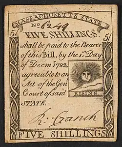A Massachusetts five-shilling note issued in 1779 with the inscription: "FIVE SHILLINGS. shall be paid to the Bearer of this Bill, by the 1st Day of Decmr. 1782 agreeable to an Act of the Genl, Court of said STATE."; Within print of sun: "RISING".
