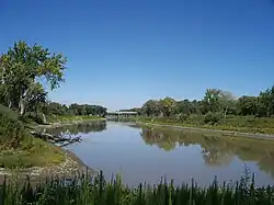 The Red River near Pembina, North Dakota, about 3 kilometres (2 mi) south of the Canada–U.S. border. The Pembina River can be seen flowing into the Red at the bottom.