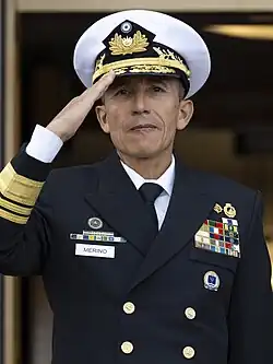 René Merino Monroy in military uniform and saluting