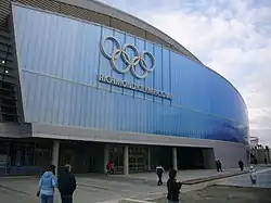 Front of a building bearing the words "Richmond Olympic Oval" and a picture of five interlocking rings.