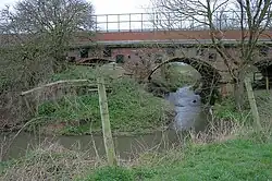 River Wiske flowing under the Wiske Railway Bridge., 54°25′44″N 1°22′16″W﻿ / ﻿54.428799; -1.371070