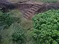 Rock-cut steps to a large cistern Pavurallakonda