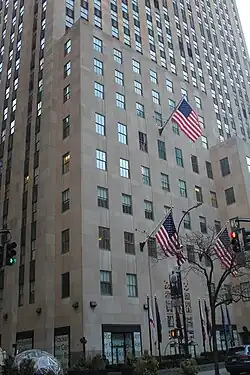 View of the western end of the south elevation, with a nine-story-tall mass in front of the main tower. At far right, a six-story wing continues east and becomes the Palazzo d'Italia.