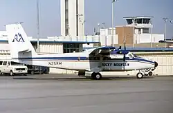 A de Havilland Canada DHC-6 Twin Otter with a blue cheatline and "Rocky Mountain Airways" text