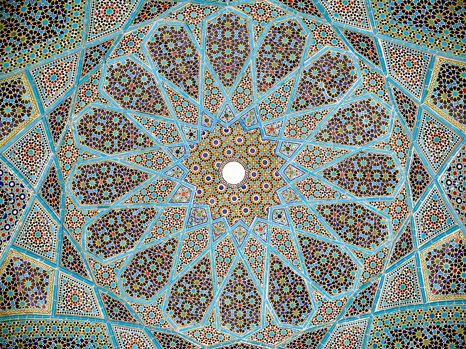Geometric arabesque tiling on the underside of the dome of Hafiz Shirazi's tomb in Shiraz, Iran