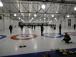 Curlers at play in a mixed receational league