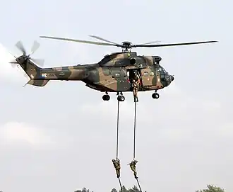 Soldiers fast roping from an Oryx helicopter