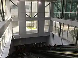 Escalators from the elevated section of the link descending to the underground section