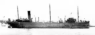 A side view of Dixie Arrow at anchor