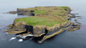 Aerial view of Staffa, with The Colonnade in the foreground and Am Buchaille to the right