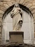 Sacred Heart statue above the main entrance.
