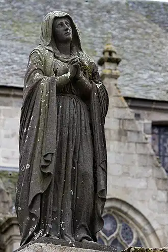 The Virgin Mary looks up towards Jesus on the cross- The Larhantec calvary at Saint-Thégonnec