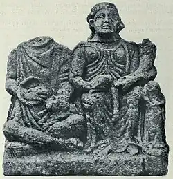 Front of a relief from Saintes, Charente-Maritime. To the left is Cernunnos with purse and torc, to the right is Abundantia with cornucopia.: no 16