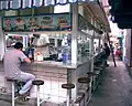 Eating at a soda in the market