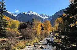 The headwaters of San Miguel River form at Ajax Peak, shown with the river.