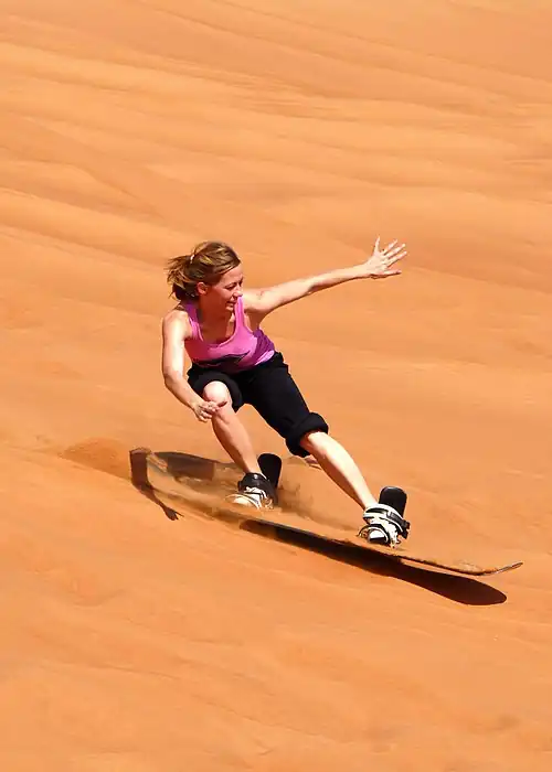 Image 21 Sandboarding Photo: Steven J. Weber/US Navy Sandboarding is a boardsport similar to snowboarding, but competitions take place on sand dunes rather than snow-covered mountains. Here, a member of the US Navy sandboards down a dune in Jebel Ali, Dubai. More selected pictures