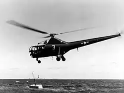 Banana shaped helicopter hovers over water