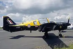 A photo of a Scottish Aviation Bulldog T1 of Bristol University Air Squadron, painted in its black and yellow BUAS livery