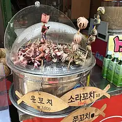 Seafood skewers sold in South Korea: mun-kkochi (giant octopus), sora-kkochi (horned turban), and jju-kkochi (webfoot octopus).