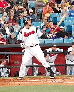 A baseball player in white