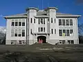 The old, wooden John Hay School (elementary) on Queen Anne Hill, designed by James Stephen, built 1905[233]