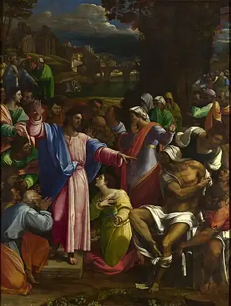 Realistic painting of a robed figure, arms extended, standing outside on a small platform among people doing various things such as talking to each other, but most of whom are looking at him.