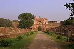 Sher Shah Suri's gate with the adjoining curon walls and Bastions and the remains of the double line of structure to its front