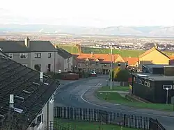 A view over houses with the Forth Valley and Ochil Hills in the background