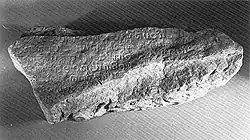 Image 22A fragment of the Singapore Stone, inscribed with an Indic script, c. 10th to 13th century. (from History of Singapore)