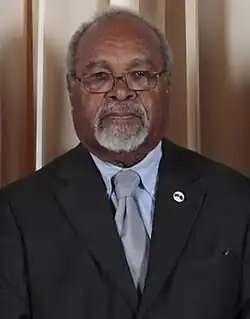 Medium close up of Michael Somare in a suit