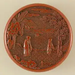 He (Small Box) with Elderly Woman and Young Boy Tending Bamboo in a Garden. Qing, Qianlong. Note the three kinds of brocade-ground.