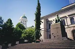 Image 13The Bank's current head office completed in 1883, with statue of J.V. Snellman by sculptor Emil Wikström in front (from Bank of Finland)