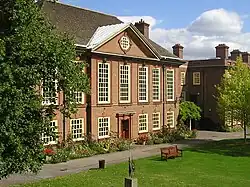 red brick neo-classical exterior of large building