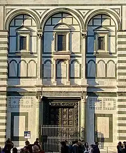 South facade of Baptistery with monumental windows similar to Pantheon aedicules