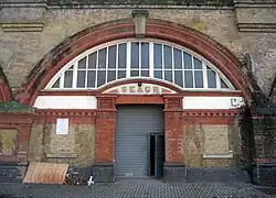 Former entrance to the station with the South Eastern and Chatham Railway initials above the doorway