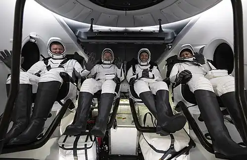 SpaceX Crew-8 astronauts inside Crew Dragon Endeavour shortly after splashdown and being lifted aboard MV Megan