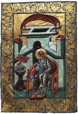 Miniature of an old man at a writing desk