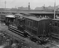 The aftermath of the 1898 St Johns rail accident, where the rear two carriages of a passenger train were telescoped by being hit at 8 mph (13 km/h) by a following train.