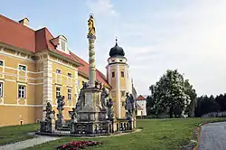 Ornate column in front of abbey