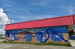 A collaborative mural painted on the Neighbourhood Space Youth Centre in 2010.