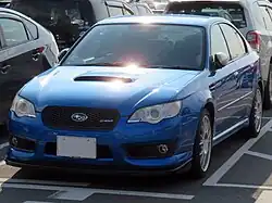 Subaru Legacy S402 sedan, a high-performance variant of the standard Subaru Legacy sedan. This photo shows the front of the car, which is blue; there is a "S402" badge on the front grille.