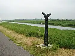 Sustrans signpost on long distance cyclepath next to Witham, once the main railway line