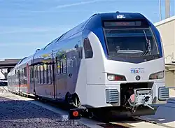 Trinity Metro TEXRail FLIRT3 arriving at DFW Airport/Terminal B station, 2019