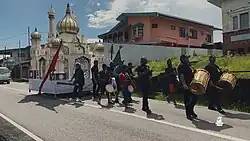 Tadjah being carried on a road